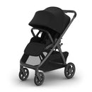 Uppababy Kona Stroller & Bassinet V3 Bundle in black, featuring a sleek design with spacious seating and a large canopy.