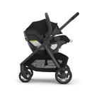Uppababy Kona Stroller & Bassinet V3 Bundle in black, featuring an infant car seat and a sleek frame design.