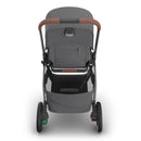 Uppababy Kona stroller in Rowan (Graphite) color, featuring a spacious seat, brown handlebar, and undercarriage storage.