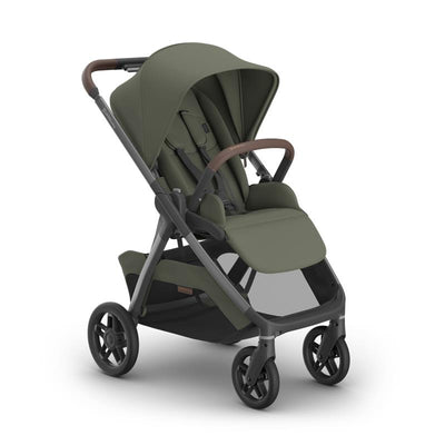 Uppababy Kona Stroller in Meadow Green with Graphite Frame and Chestnut Leather handle, featuring a sturdy design and spacious seat.