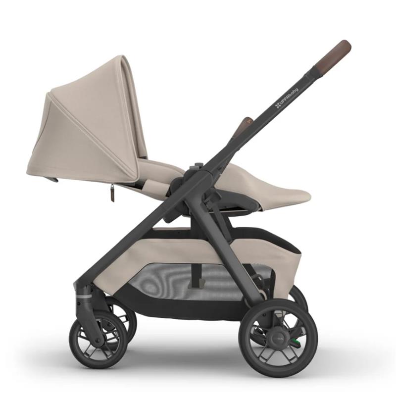 Uppababy Kona stroller in Ada (Sandstone Mélange) configuration with a tan seat and a black frame.