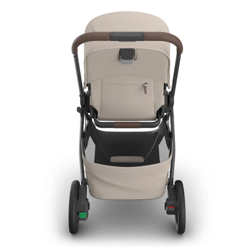 Uppababy Kona stroller in Ada (Sandstone Mélange) color, featuring a brown handle, spacious seat, and storage basket.