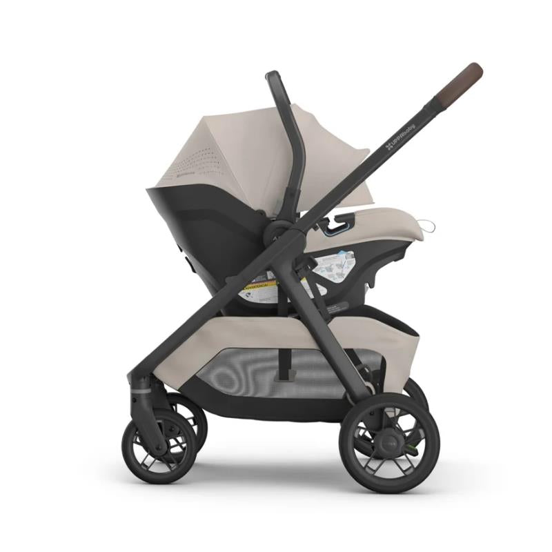 Uppababy Kona Stroller and Mesa V3 infant car seat in Ada (Sandstone Mélange) configuration; stylish and functional design.