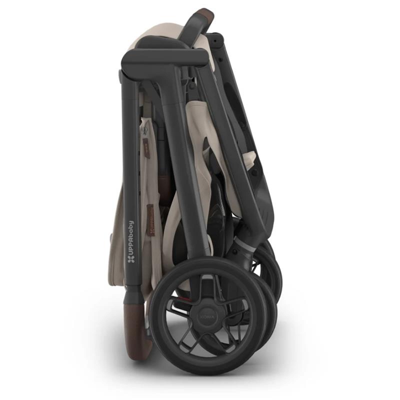 Uppababy Kona Stroller & Mesa V3 Travel System in Ada color, compactly folded with prominent wheels and handle.