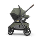 Uppababy Kona Stroller & Mesa V3 Travel System in Meadow Green, showcasing its car seat attached to the stroller frame.