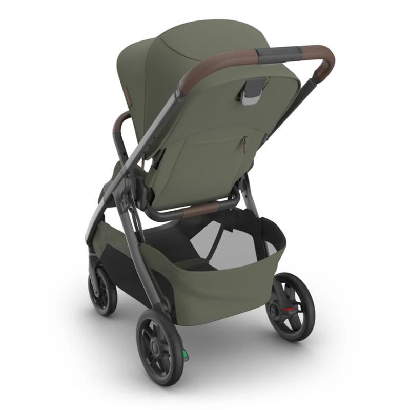 Uppababy Kona stroller in Meadow Green with a sleek design, adjustable seat, and a spacious storage basket.