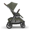 Uppababy Kona Stroller in Meadow Green with a reclining seat, adjustable canopy, and a sleek frame design.