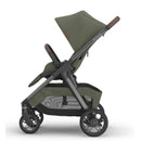 Uppababy Kona Stroller in Meadow Green with brown handle, showcasing a modern design and adjustable features.