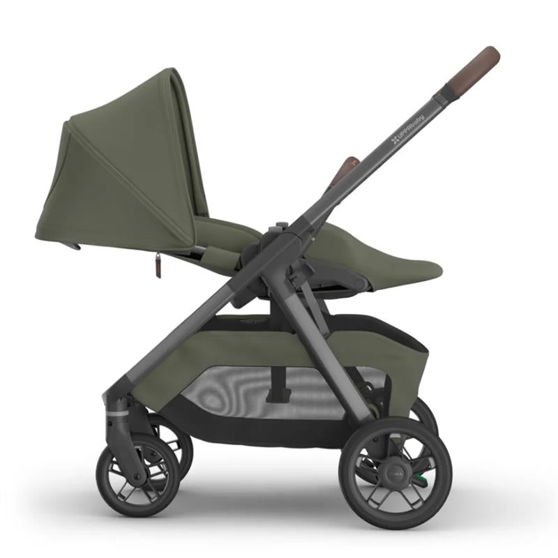 Uppababy Kona stroller in Meadow Green, featuring a sleek design with a large canopy and spacious storage basket.