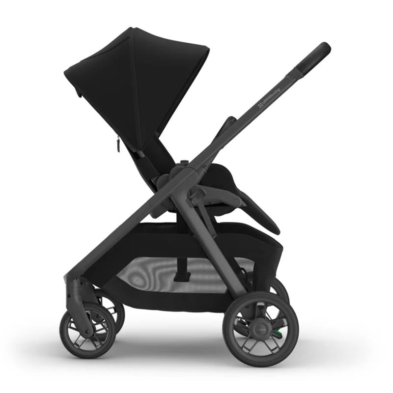Uppababy Kona stroller in black with a large canopy, adjustable seat, and storage basket, showcasing a sleek design.