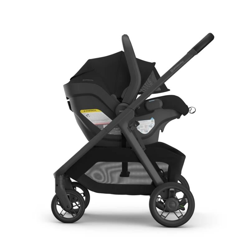 Uppababy Kona Stroller with Mesa V3 infant car seat in black, showcasing a sleek design and safety features.