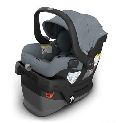 Uppababy Mesa V3 infant car seat in Stone Blue with a removable canopy and safety labels visible.