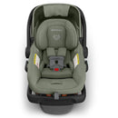 Uppababy Mesa V3 Infant Car Seat in Meadow Green with a padded interior, safety harness, and removable canopy.