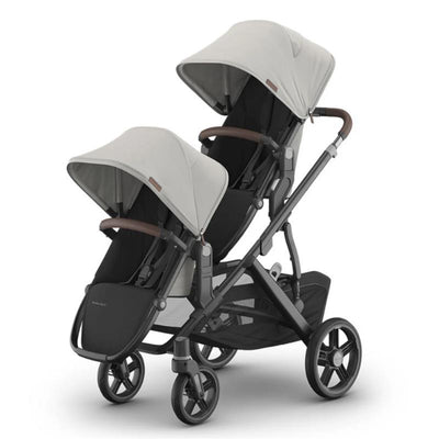 Uppababy Savannah Vista V3 stroller with a Savannah Rumbleseat, featuring dual canopies and brown leather accents.