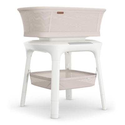 Soma Smart Bassinet by Uppababy in Charlie (Sand Mélange) color, featuring a spacious sleeping area and a storage compartment below.