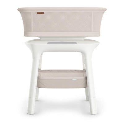 Uppababy Soma Smart Bassinet in Charlie color, featuring a breathable mesh top and a storage basket below.