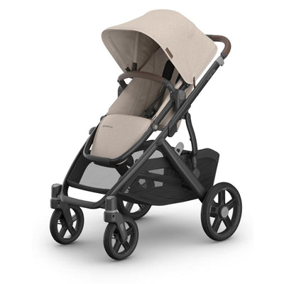 Uppababy Vista V3 Stroller in Ada Sandstone Melange with Chestnut Leather accents, showcasing a sleek design and spacious seating.