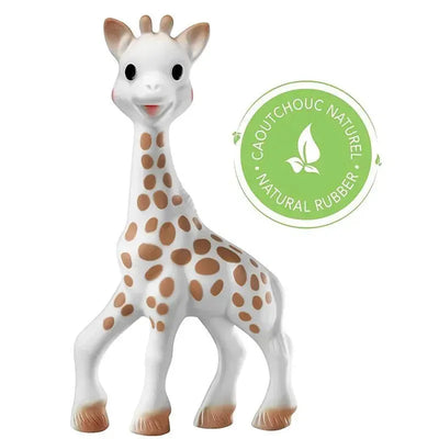 Vulli Sophie The Giraffe, a small soft toy made of natural rubber, featuring a smiling face and brown spots.
