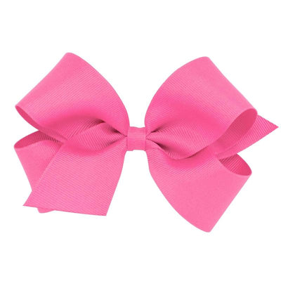 Medium hot pink grosgrain hair bow on a WeeStay clip, featuring a symmetrical design with wide loops.