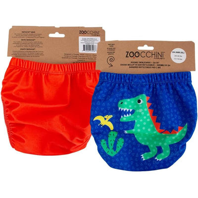 Reusable Zoocchini swim diaper set featuring an orange diaper and a blue diaper with a green dinosaur graphic.