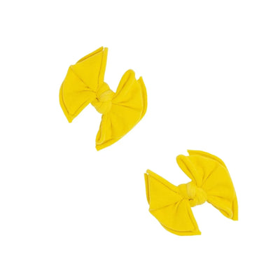Two canary yellow Baby Bling Bows fabric hair clips for babies.