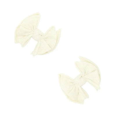 Two ivory fabric hair bow clips by Baby Bling Bows on a white background